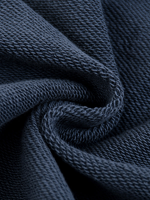 Close-up of dark blue fabric with a textured pattern