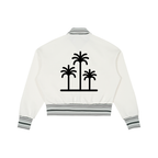 White jacket with black palm tree design on the back against a white background