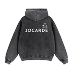 Black hoodie with 'JOCARDE' logo on the back against a white background